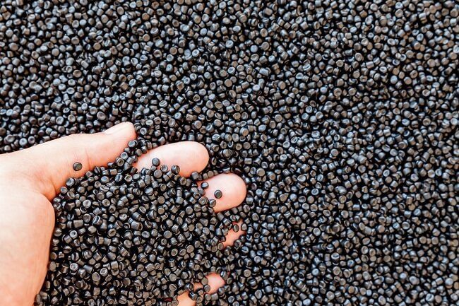 stock-photo-close-up-of-plastic-polymer-granules-hand-hold-polymer-pellets-polymer-plastic-compound-polymer-1373003549